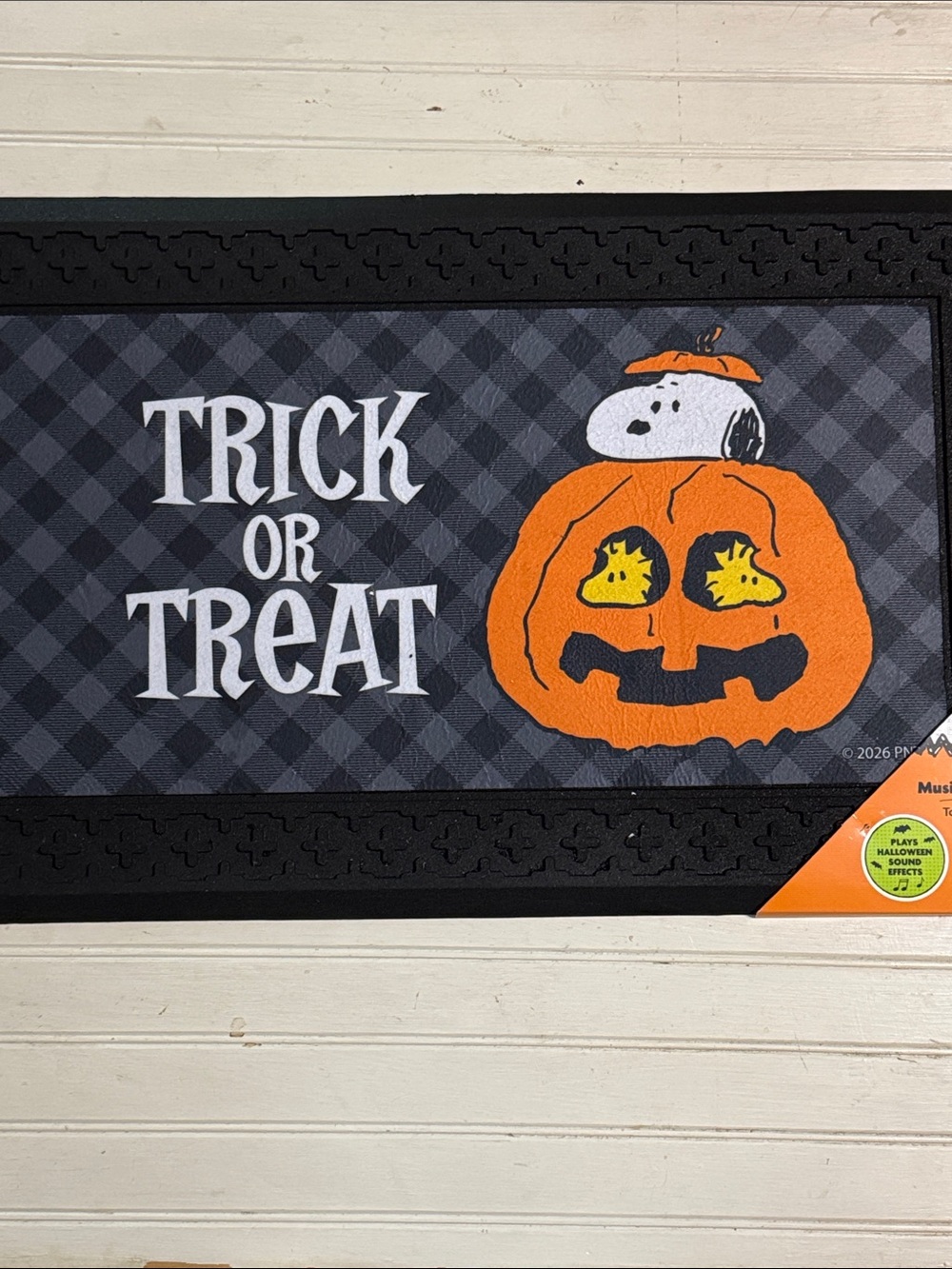 Musical Peanuts Halloween Doormat with Snoopy in a jack o lantern with Woodstock